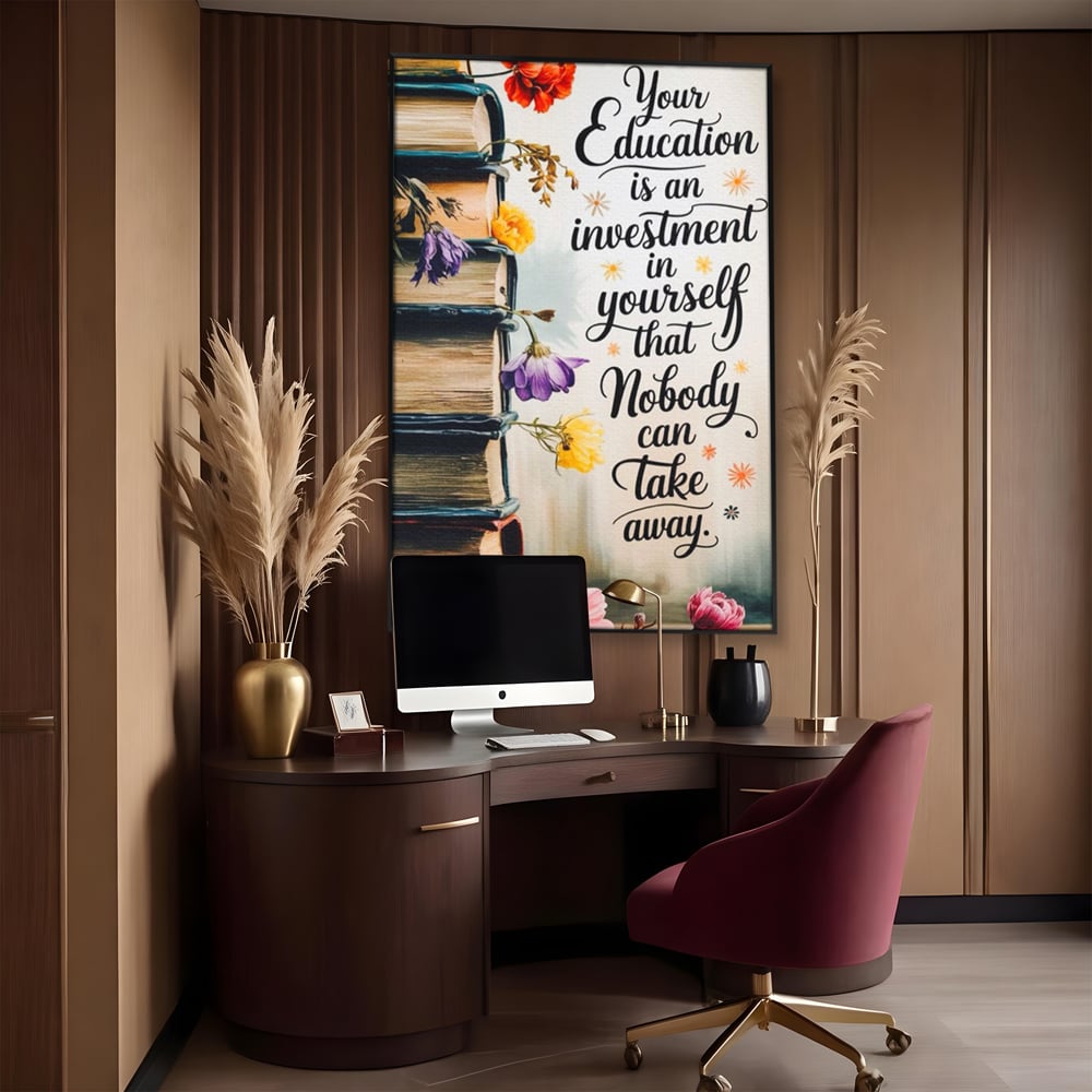 Tablou canvas cu tablou motivational cu teanc de carti si flori, in rama de aluminiu negru, pe perete intr-un birou